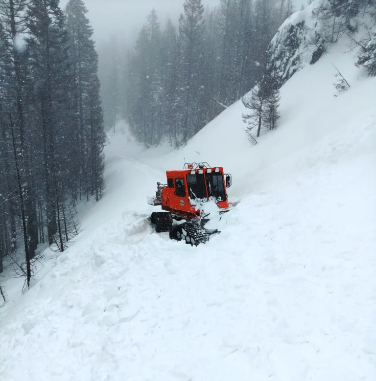Snowcat plowing the back country. Beaver Creek Snowcat.